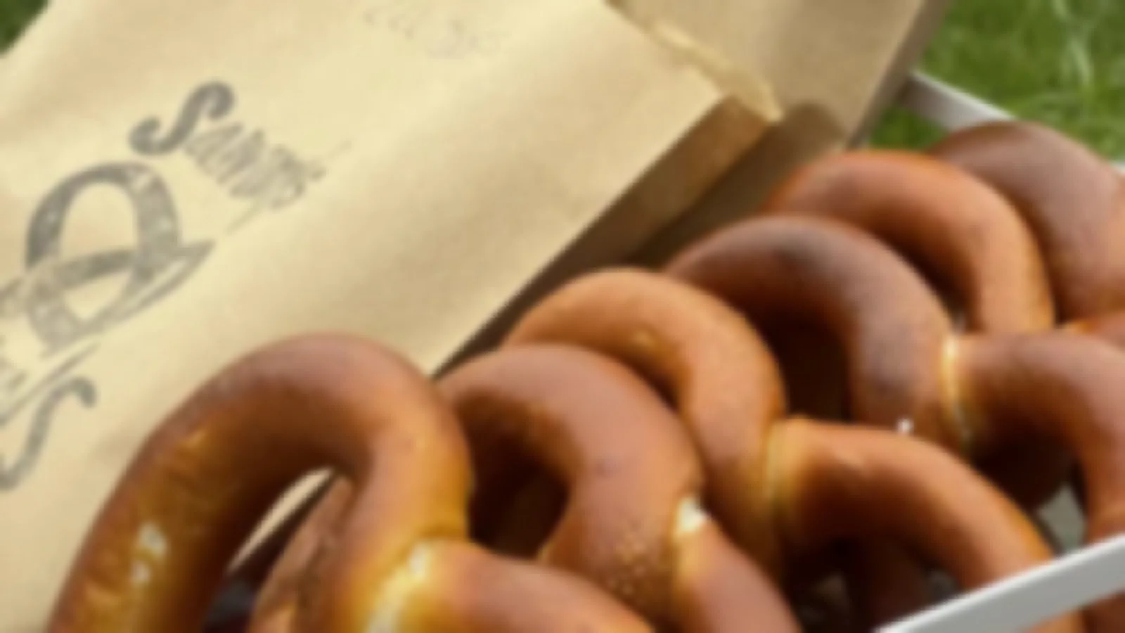 Handmade German soft pretzels (Brezels) laid out for a workplace morning tea